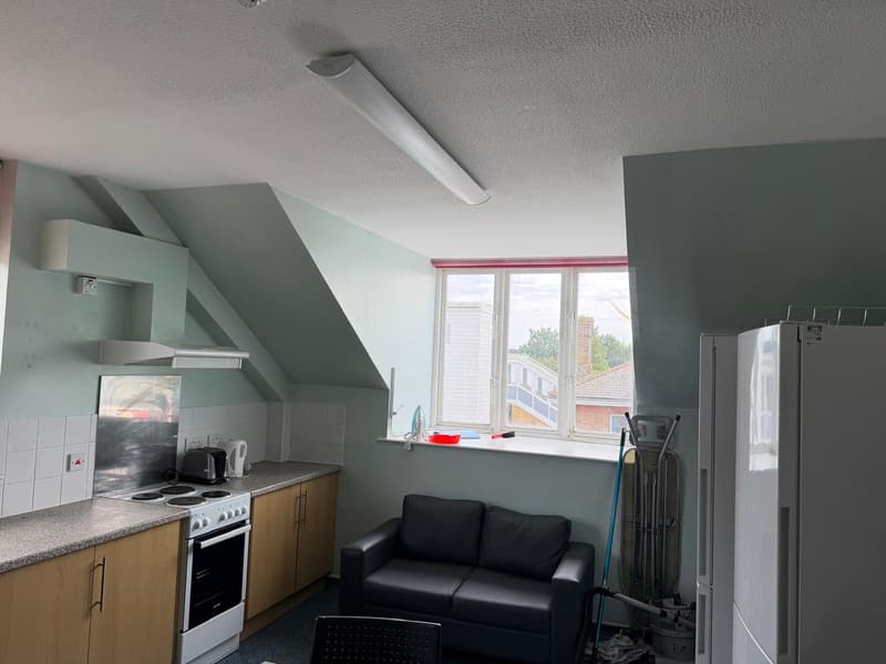 Kitchenette and seating under the eaves