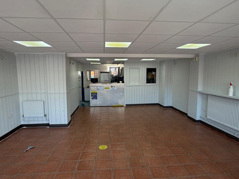 After: the same cafeteria with the panelling painted white