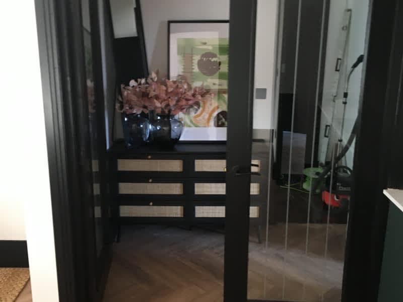 Hallway with glazed partition and dark woodwork