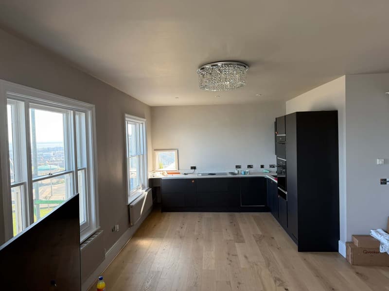 Open-plan kitchen and living room with sea views