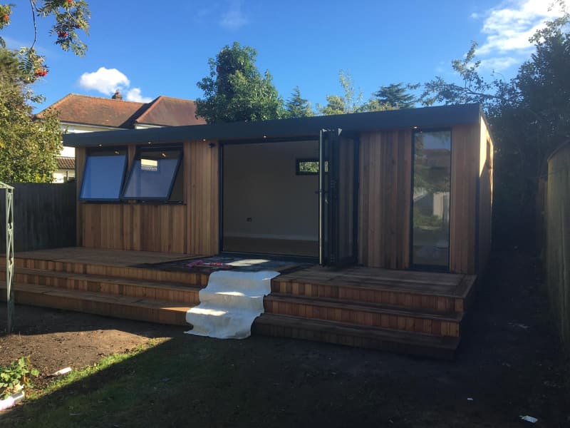 Garden room with decking and steps