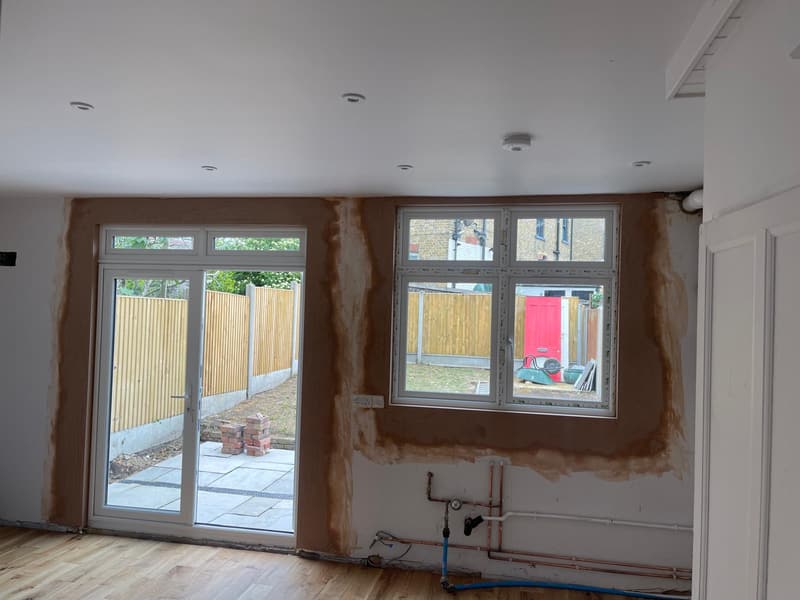 Rear room mid-job, walls made good around new doors