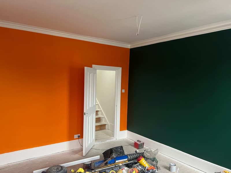 Burnt orange and deep green, with crisp white woodwork