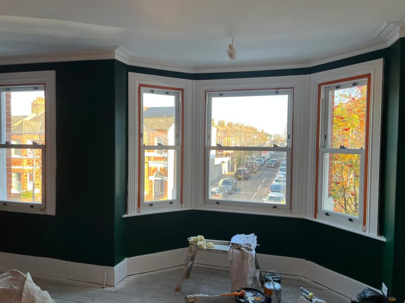 Deep green bay window room